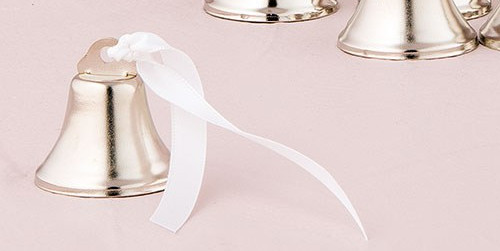 A silver bell with a white ribbon.