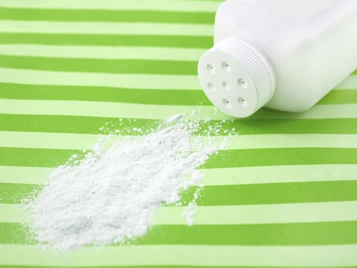 Baby powder spilling on striped background