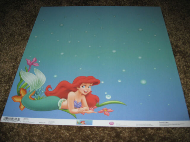 Blue notepaper with a redheaded mermaid on it