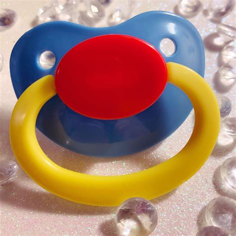 Red, yellow and blue dummy or pacifier
