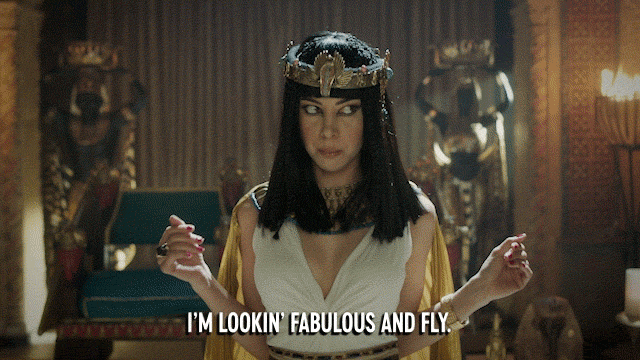 Aubrey Plaza dressed as Cleopatra, saying "I'm lookin' fabulous and fly."