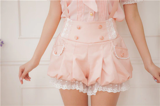 Peach short bloomers with lace trim.