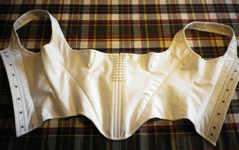 An open white vintage corset, or stays