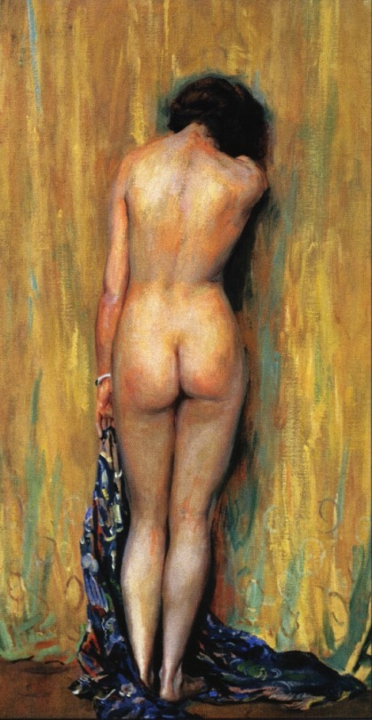 Nude woman standing facing the corner wall of a room with head bowed.