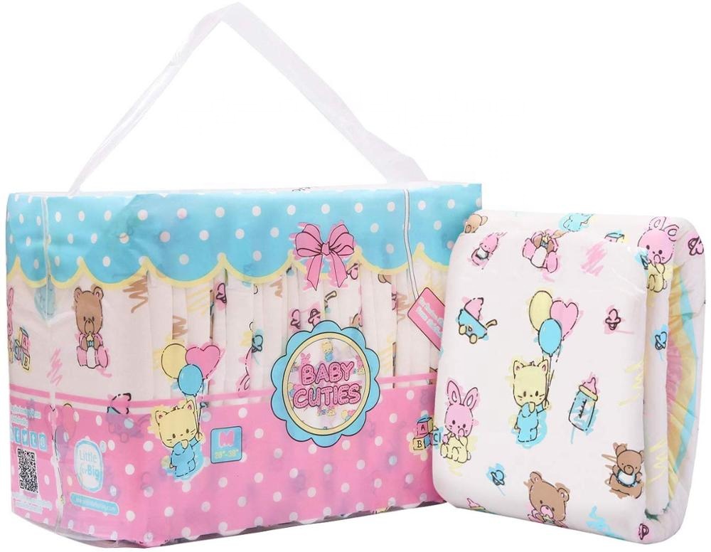 A pack of cute pink and white adult nappies with kittens and bunnies printed on them. The label reads 'Baby Cuties'.
