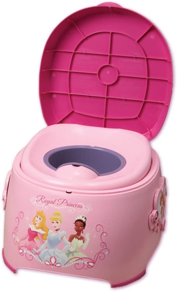 A pink plastic potty with three disney princesses on it.