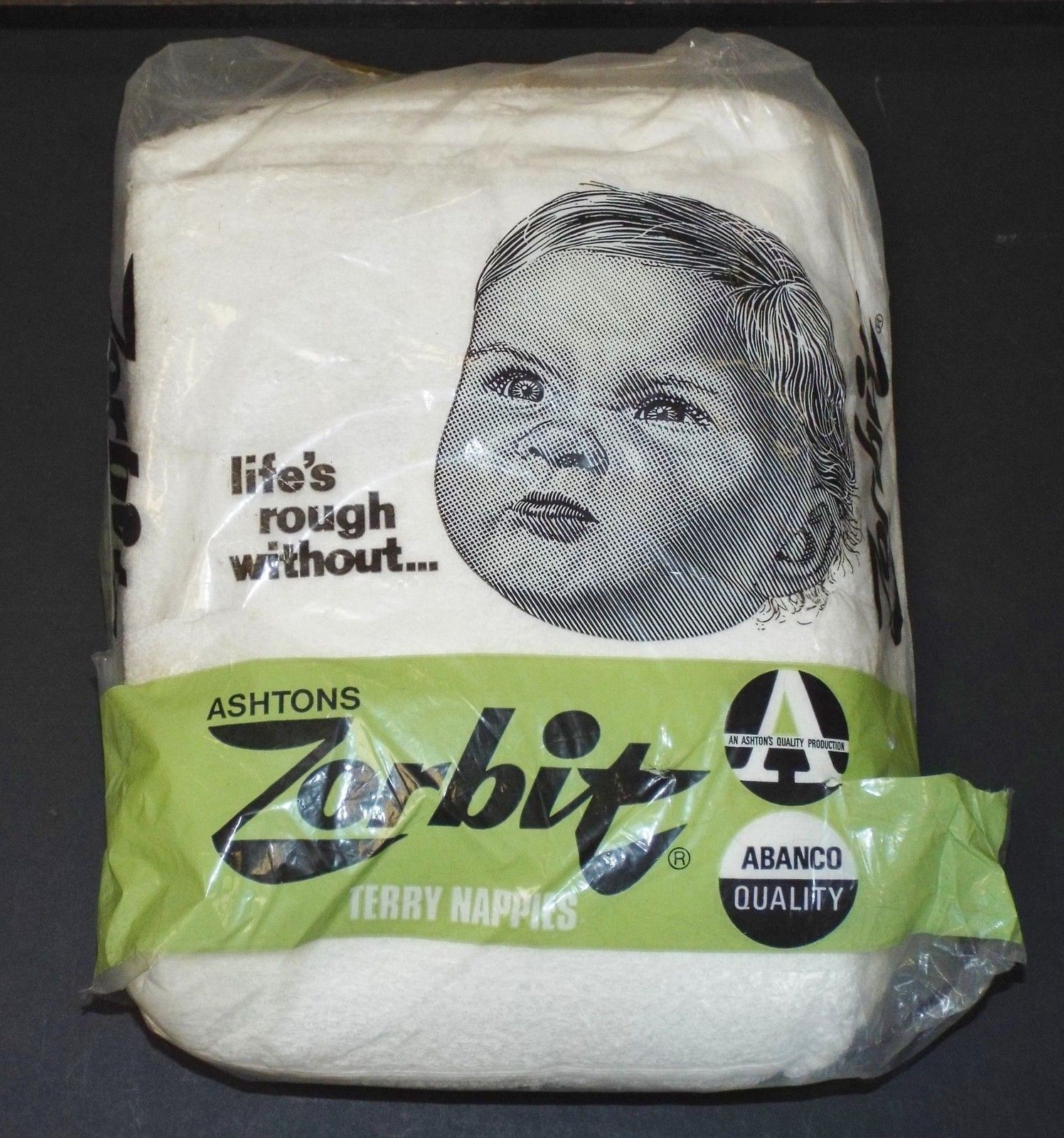 Vintage pack of cloth nappies with a picture of a grumpy baby on the front. Slogan reads: "Life's rough without Zorbit terry nappies"